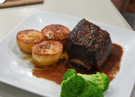 Slow cooked pulled beef rib with heart shaped fondant roasted root veg